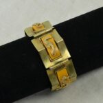 Bracelet Art Déco Jean Painlevé - Bakélite Rouge Et Laiton Doré - Thème Musique