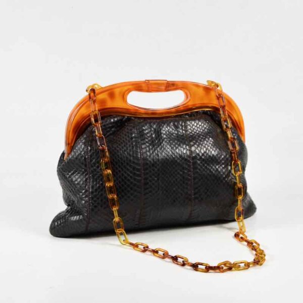 Black snakeskin clutch with celluloid chain