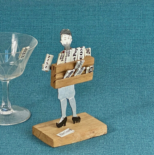 Sudre Art Deco drinks marker, newspaper seller