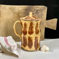 Large antique French pottery pitcher from the 19thy century with cream and brown glaze