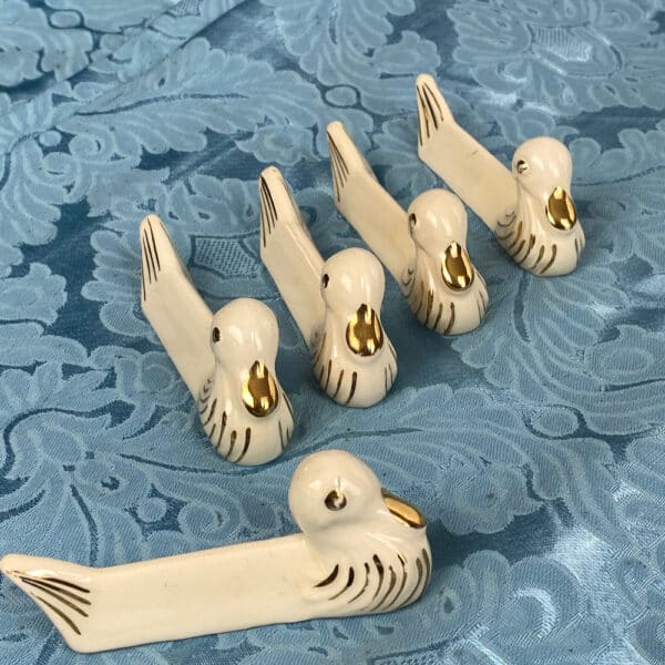 Art Deco French knife rests in the shape of ducks, set of vintage ceramic cutlery rests in white and gold (2)
